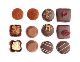 Tasty chocolate candies on white background, flat lay