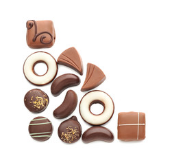 Composition with tasty chocolate candies on white background, flat lay