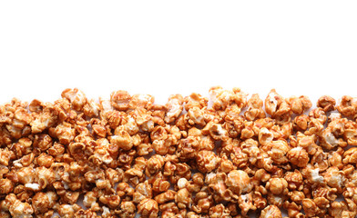 Delicious popcorn with caramel on white background - obrazy, fototapety, plakaty