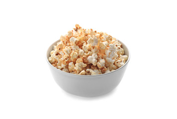 Fototapeta na wymiar Bowl of delicious popcorn on white background
