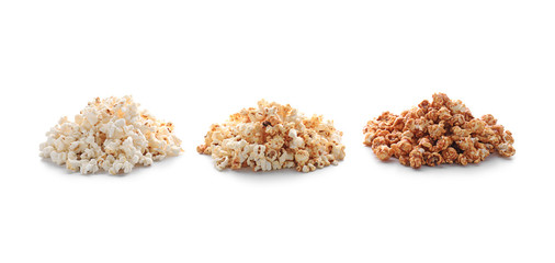 Piles of delicious popcorn on white background