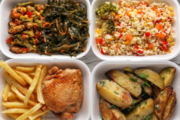 Plastic containers with delicious food as background. Delivery service