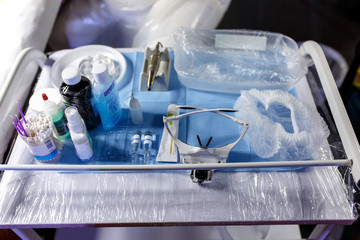 various tools for professional permanent makeup on medicine table