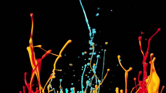 Colorful splashing paint in super slow motion. Shot with high speed cinema camera, 1000fps