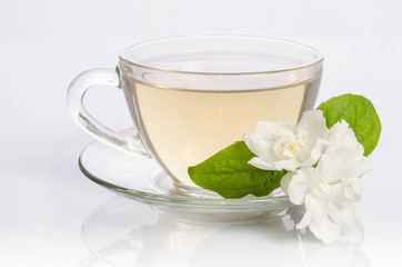 Glass cup of Tea with jasmine flowers