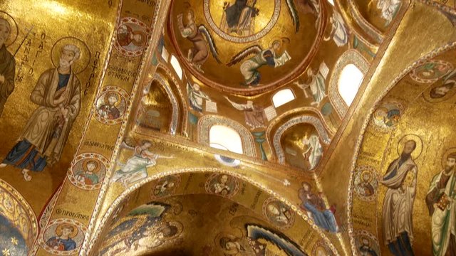 Palermo, Italy - April 28, 2018: Christ in the dome beautiful Byzantine mosaics of the 12th century and the newer part is decorated with later frescoes the 18th century in the Martorana church.