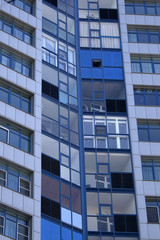 blue facade of high-rise apartment house