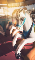 Fototapeta na wymiar Fairground carousel or merry go round horses