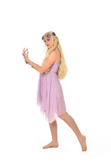 Naklejka premium full length portrait of pretty blonde girl wearing purple fairy dress. standing pose, isolated on white studio background.