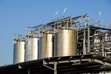 Silver wine Silos with blue sky in background