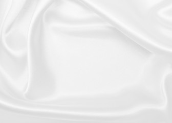 Smooth elegant white silk or satin luxury cloth texture as wedding background. Luxurious background design