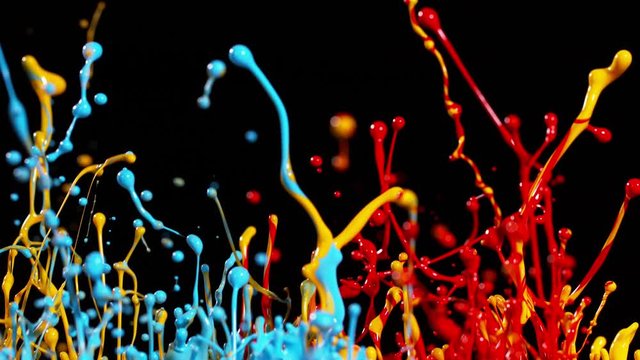 Colorful splashing paint in super slow motion. Shot with high speed cinema camera, 1000fps