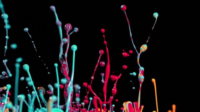Colorful splashing paint in super slow motion. Shot with high speed cinema camera, 1000fps
