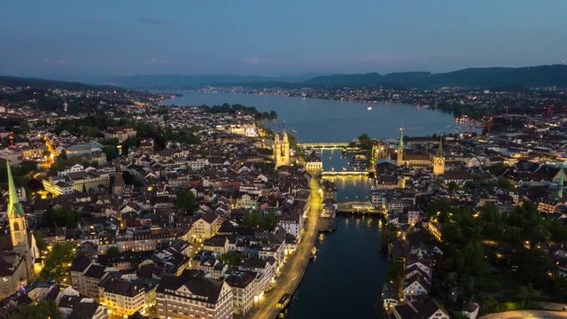 evening illumination zurich center cityscape riverside aerial panorama 4k timelapse switzerland
