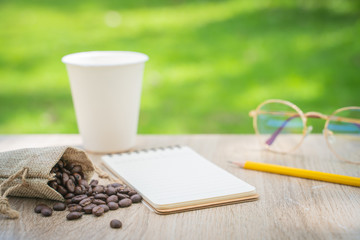 Writing stories about coffee beans. Morning light with paper and pencil