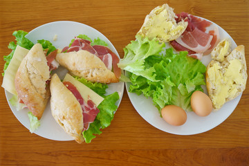 Breakfast: sandwiches, jamon, salad, bread and butter, eggs - everything you need for happiness in the morning