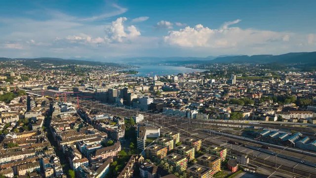 sunny day zurich cityscape river train station railways aerial panorama 4k timelapse switzerland
