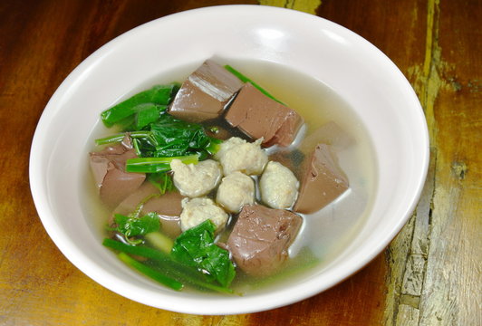 boiled pork blood with vegetable gourd and minced pork soup on bowl