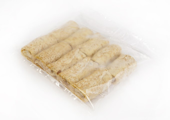 Semi-finished products. Frozen pancakes with cottage cheese in a tselofanovoy packing.