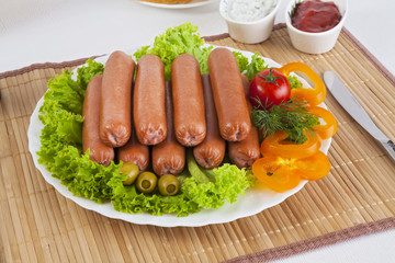 Sausages smoked with tomatoes, cucumbers and greens. Served with black or white bread.