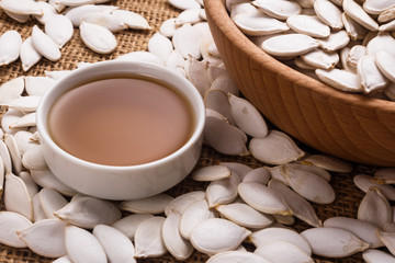 pumpkin seed oil on a rustic background