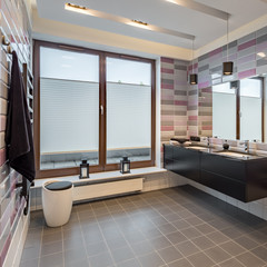 Spacious bathroom with brick tiles