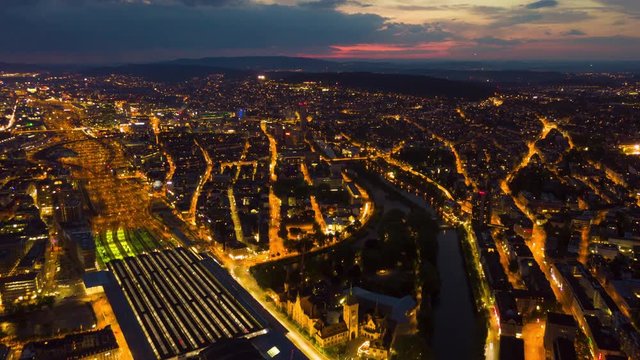 sunset sky night illuminated zurich cityscape traffic street aerial panorama 4k timelapse switzerland
