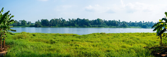 Panoramic river view in Kerala's Backwaters, India.