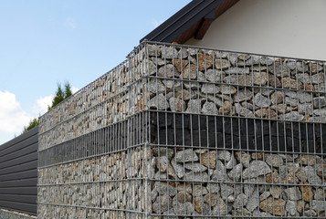 A fragment of a fence made of a gabion