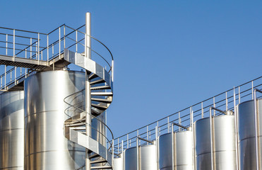 Silver wine Silos with blue sky in background