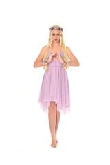 full length portrait of pretty blonde girl wearing purple fairy dress. standing pose, isolated on white studio background.