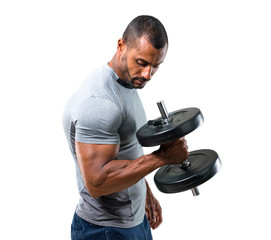 Strong handsome sport man making weightlifting and exercising the biceps on isolated white...