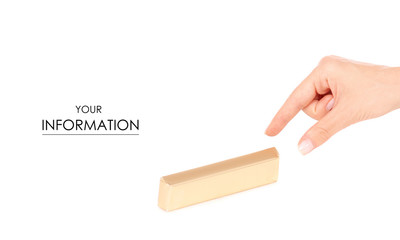 A bar of chocolate in a golden wrapper in hand pattern on white background isolation