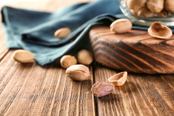 Tasty pistachios on table, closeup