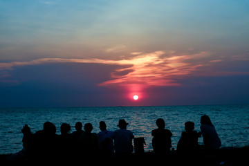 silhouette all people in family meeting look sunset sky on beach