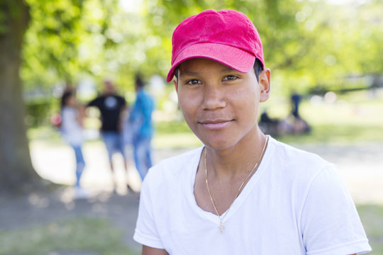 Portrait of teenage boy (14-15) in park