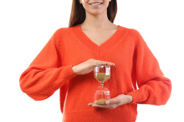Woman holding hourglass on white background. Time management concept