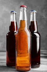 Fresh beer in glass bottles on table
