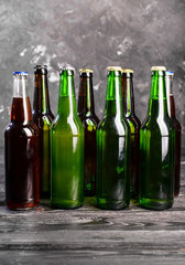 Fresh beer in glass bottles on table