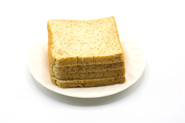 Slice bread on white dish and white background,soft focus.