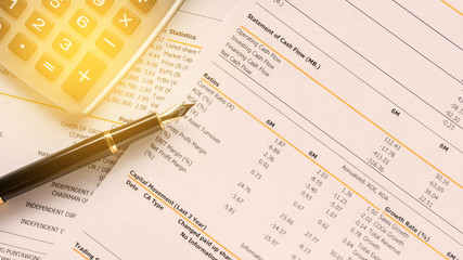 stock exchange report data number analysis for investment with pen