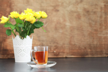 A cup with tea on the table