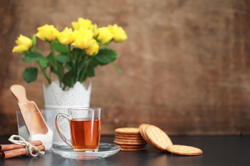A cup with tea on the table