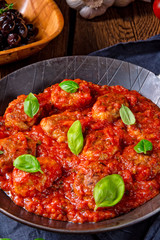 Rustic mini meatballs  Baked  in tomato sauce with basil