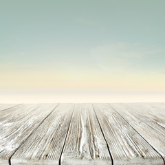 Tropical Beach Background with Sand, Blue Sky and Sea – Wooden table or deck and Copy Space for...