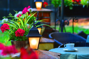 Coffee in a beautiful restaurant with flowers and lamps