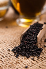 fresh sesame seeds on a rustic background