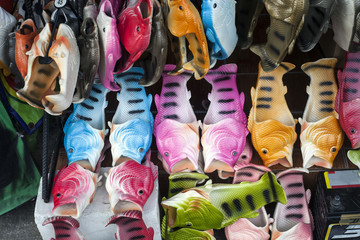 Rubber slippers in form of fish on market