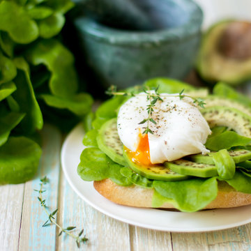 Egg-poached with ciabatta, avocado and baby lettuce leaves