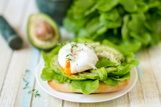 Egg-poached with ciabatta, avocado and baby lettuce leaves